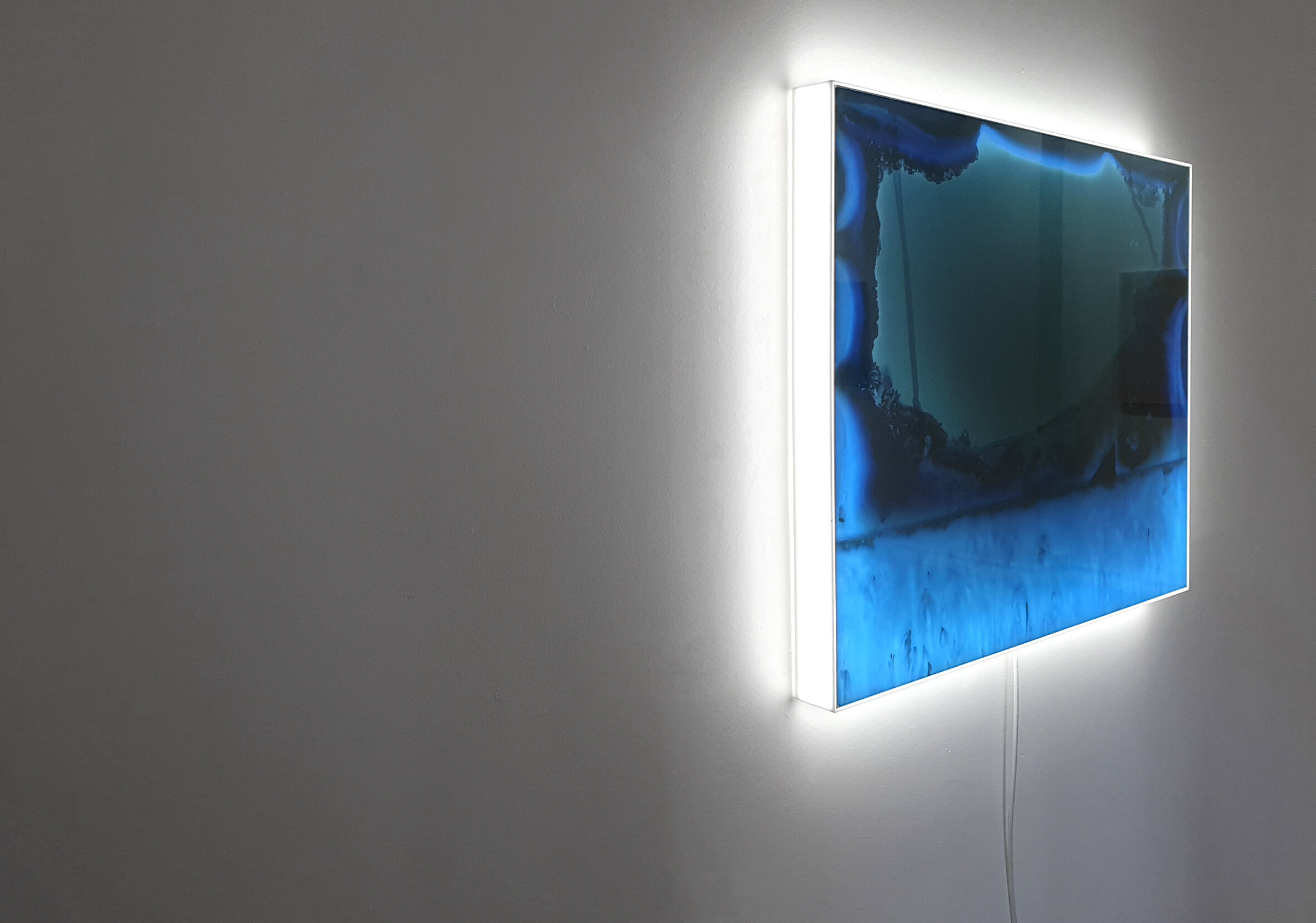 ‘Luminous Capture #7 (positive)’ - animated lightbox, LED lights, microprocessor, duratrans, custom acrylic housing. Releasing light until it vanishes - Hannah Jenkins http://rundog.art/luminous-capture-yvette-hamilton/ “The meditative tick and whir of the lightbox heating up and fading back down is hypnotic. Perhaps some ingrained memory of mine recognises this characteristic and immediately associates the pattern with the rhythmic sound of waves crashing. The automation of ‘Luminous Capture #7 (positive)’ (2019) feels like time ticking through minutes, decades, centuries. Each flash is a slice of time, happening in both a linear fashion—one after the other, but also collapsing—one on top of the other. How fast did that time move across the sky, and reflect back into my eyes? Am I truly capable of seeing every flash from storm Diana or just the prolonged exposure? These works have captured light, but they also acknowledge that light expands out to the horizon and into the dark—and allow it the space (and time) to do so. Now the light is looking at me.”