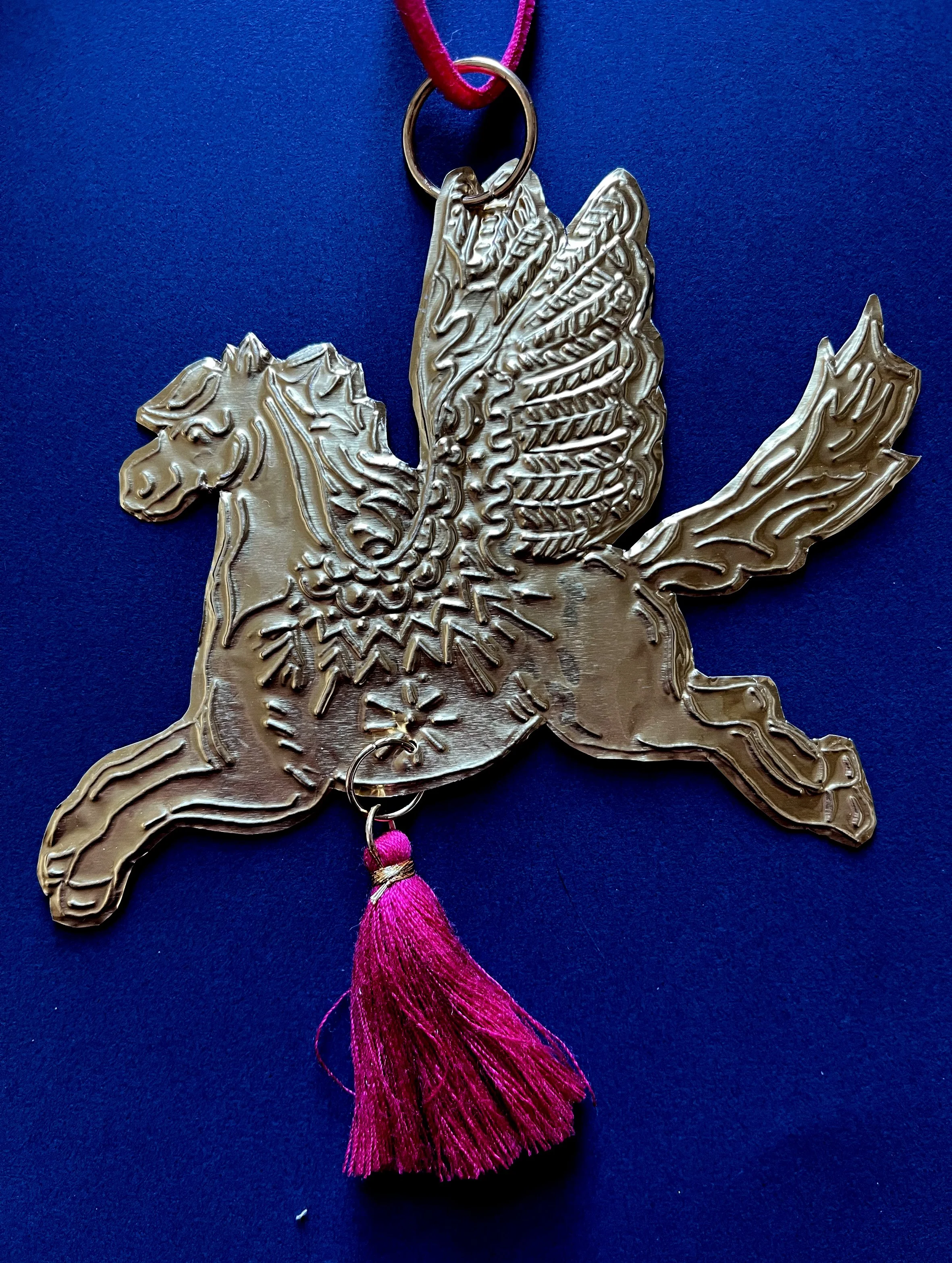 horse tassel on blue.jpg