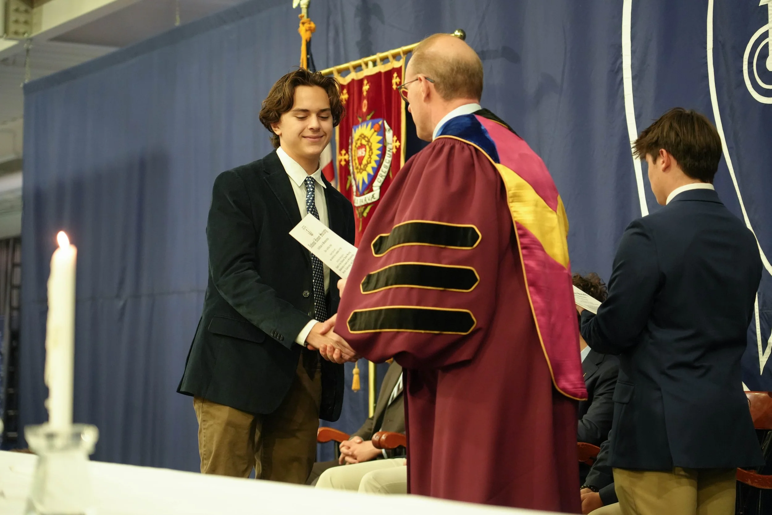 Heath being inducted into the National Honor Society at SJP