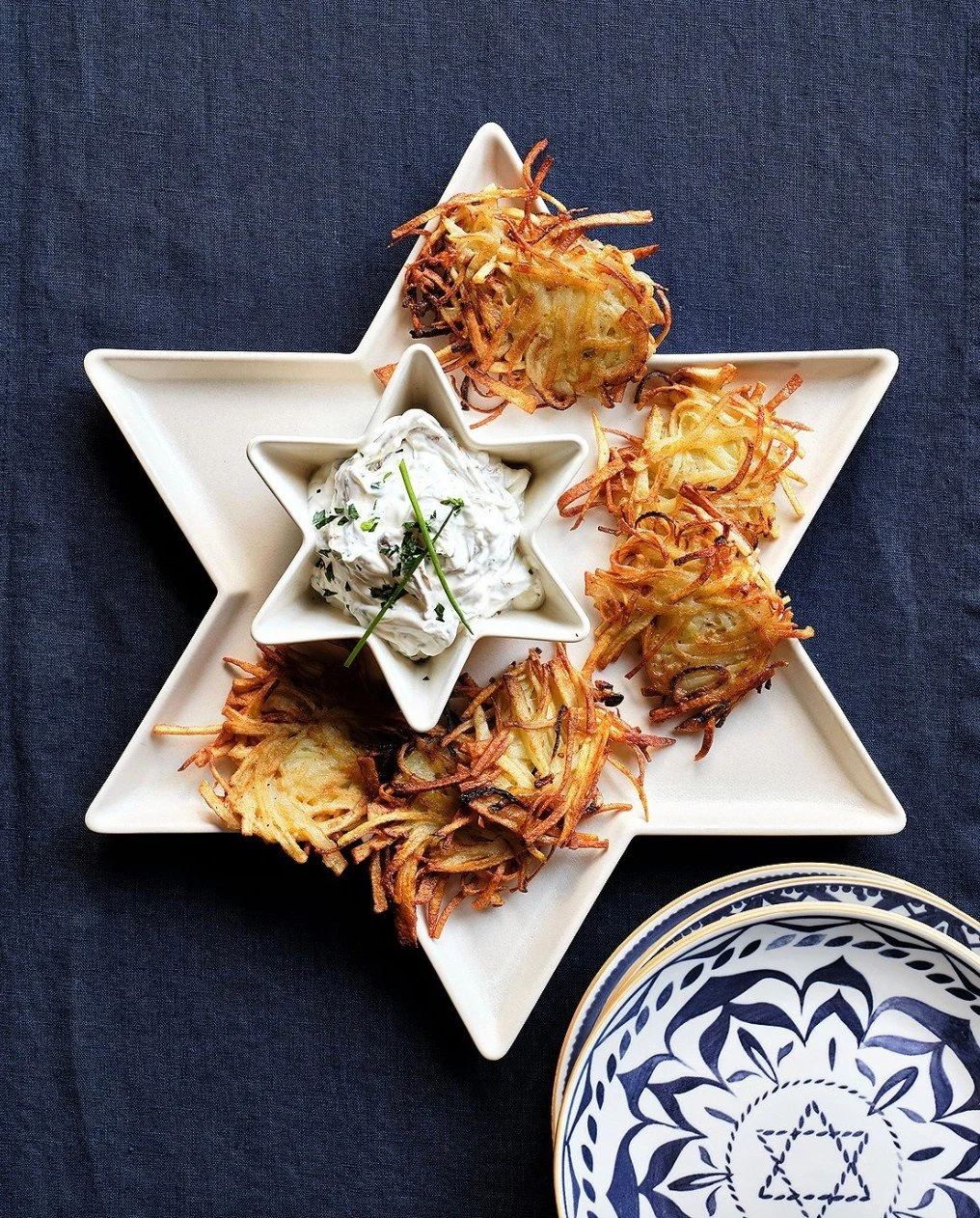 Celebrate the season of light with these perfect touches from @crateandbarrel. ✨ From timeless menorahs to beautifully crafted Hanukkah d&eacute;cor and serving essentials, each piece brings warmth, tradition and effortless elegance to your holiday t