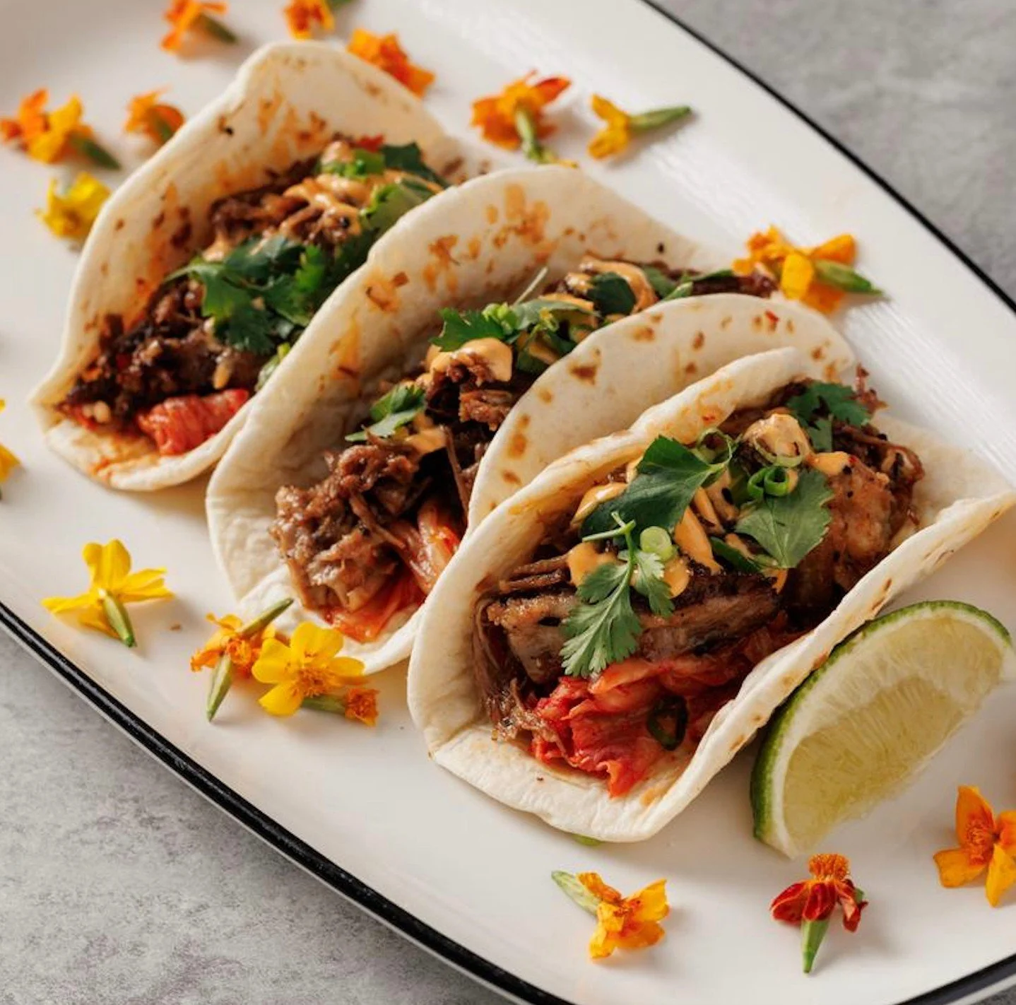 We're fueling up for a delicious weekend of shopping, strolling and savoring the season's best flavors&mdash;and we're starting with the Kogi Beef Tacos from @craveamerica! 🌮 Featuring kalbi-marinated short rib, kimchi, spicy mayo, onion and cilantr