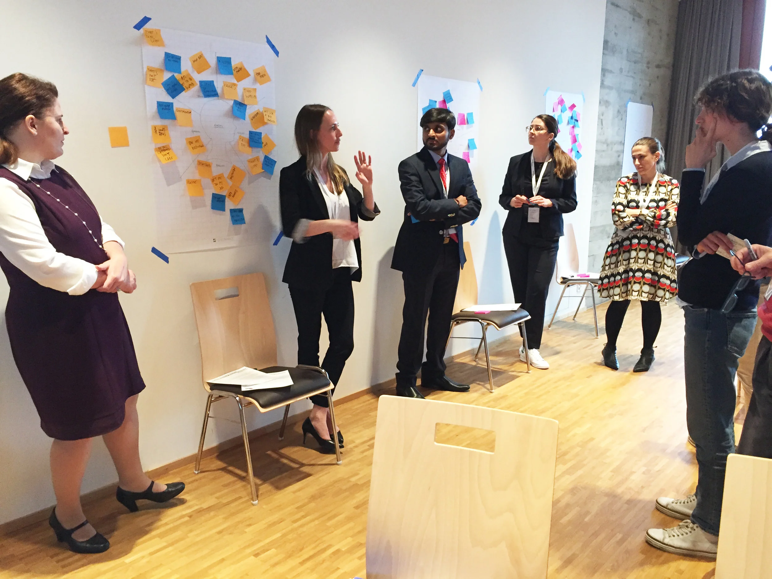 Senior Ethicist Elizabeth Edenberg leads a group discussion following an empathy mapping workshop at a Jesuit business ethics conference.