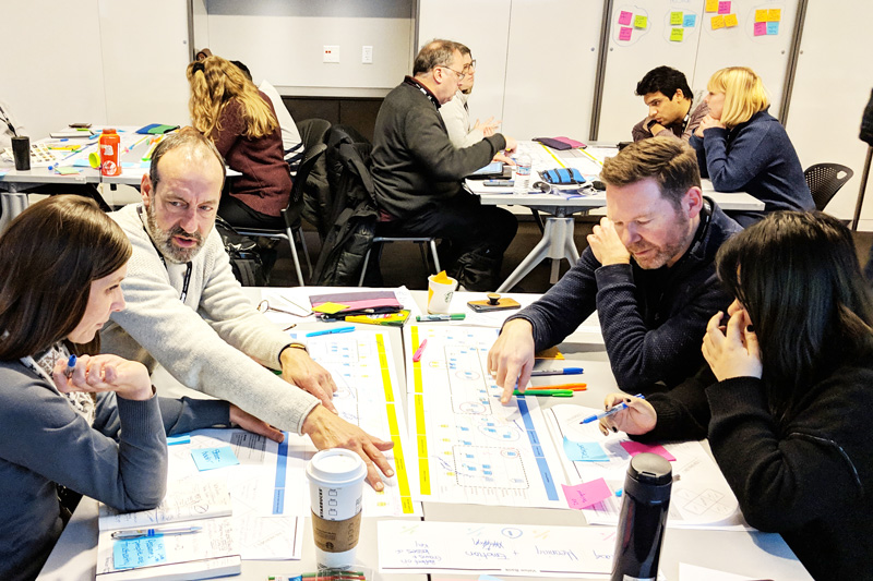 Workshop participants assess an in-home package delivery service using their identified values as a metric success.