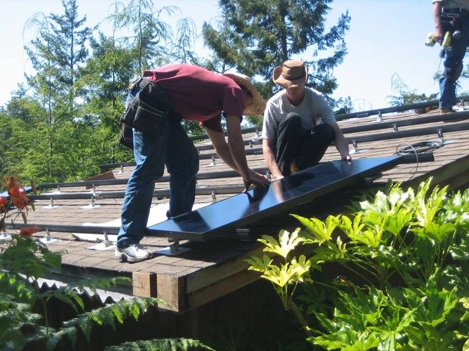 workers on roof installing solar.jpg