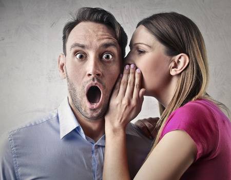 59244036-woman-whispering-into-a-man-s-ear.jpg