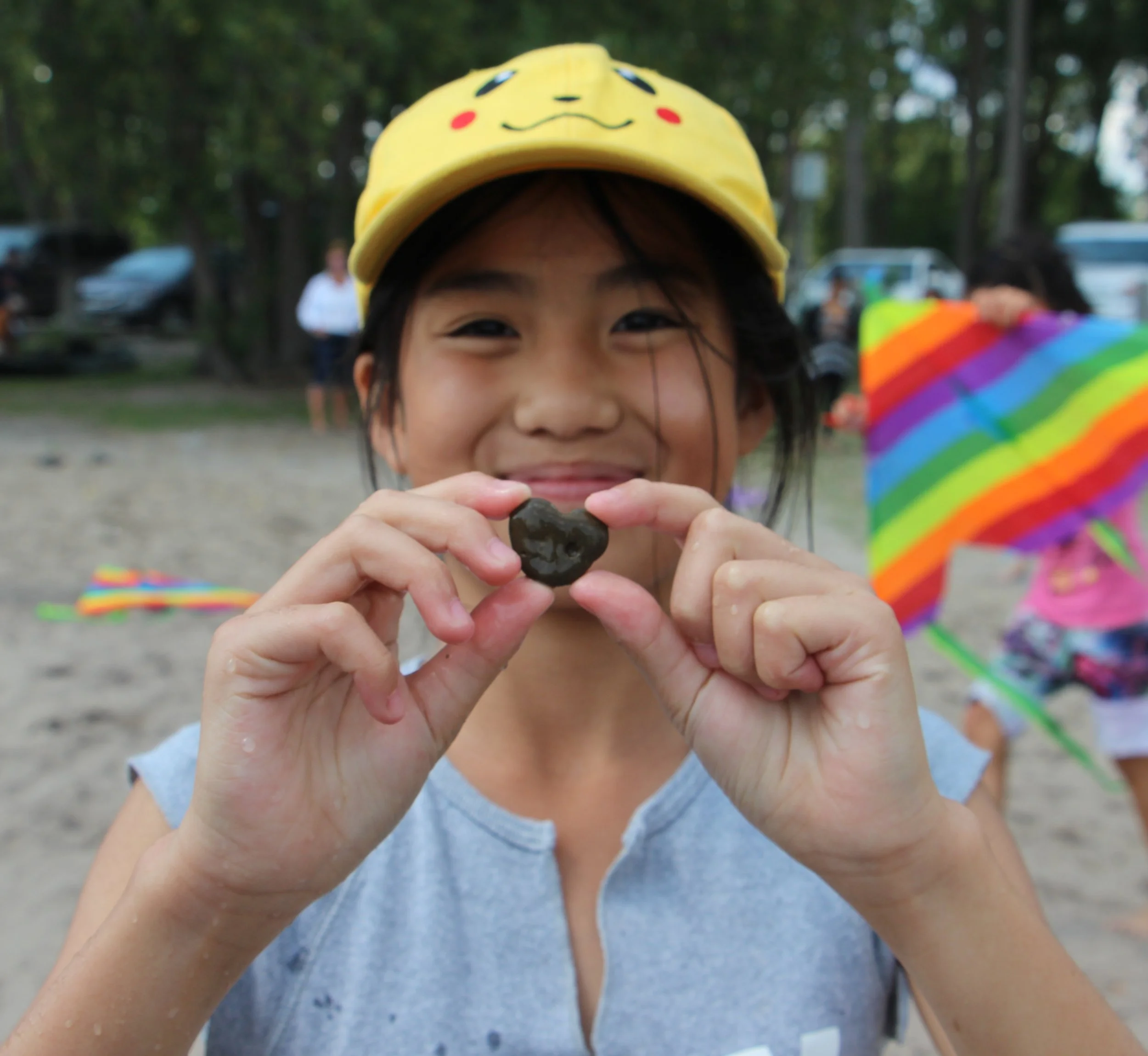 Nellie's_Child holding a stone that looks like a heart cropped.jpg