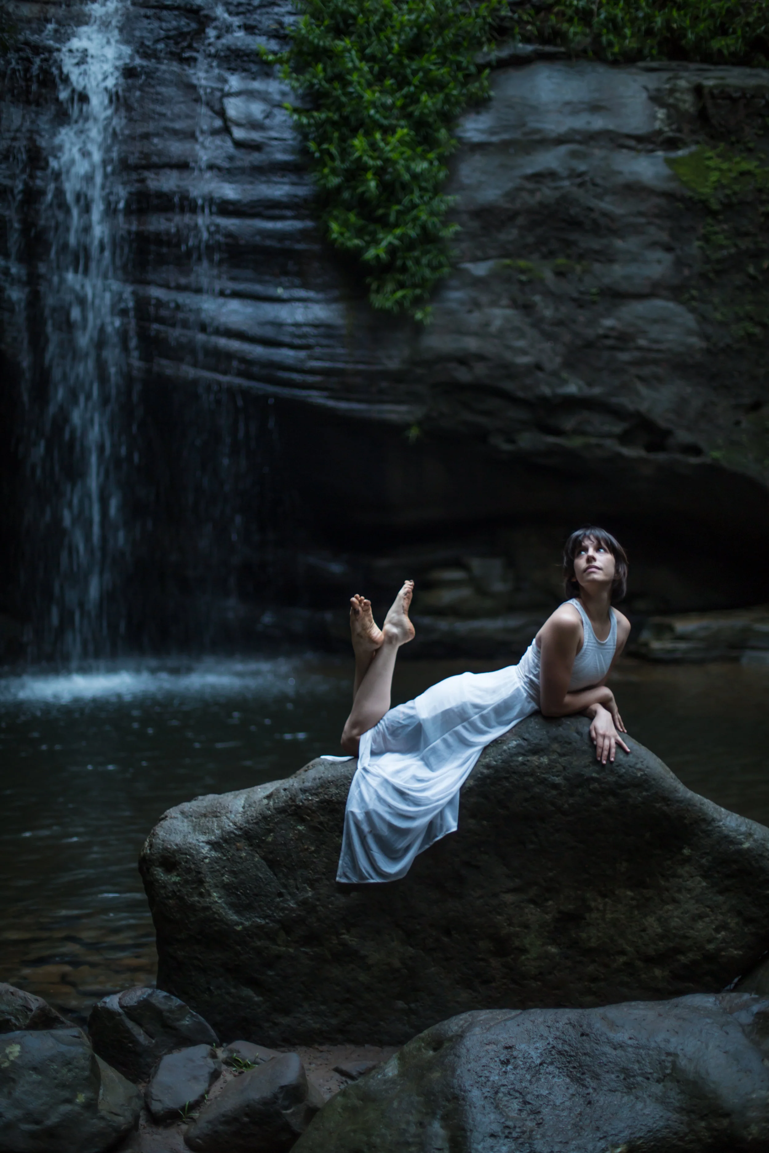 Model Ellie is seen in a white dress, depicted more in this photo in a “mainstream” way of modeling, compared to the photo to the right. Photo credit: @skshibari