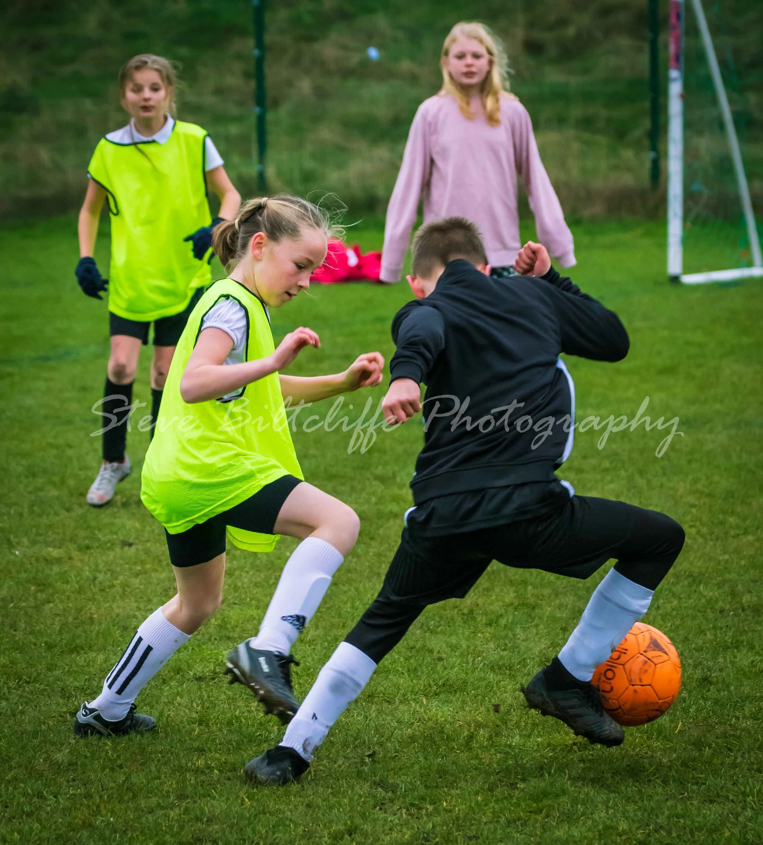 Kings Meadow and South Kirby battling for the ball.