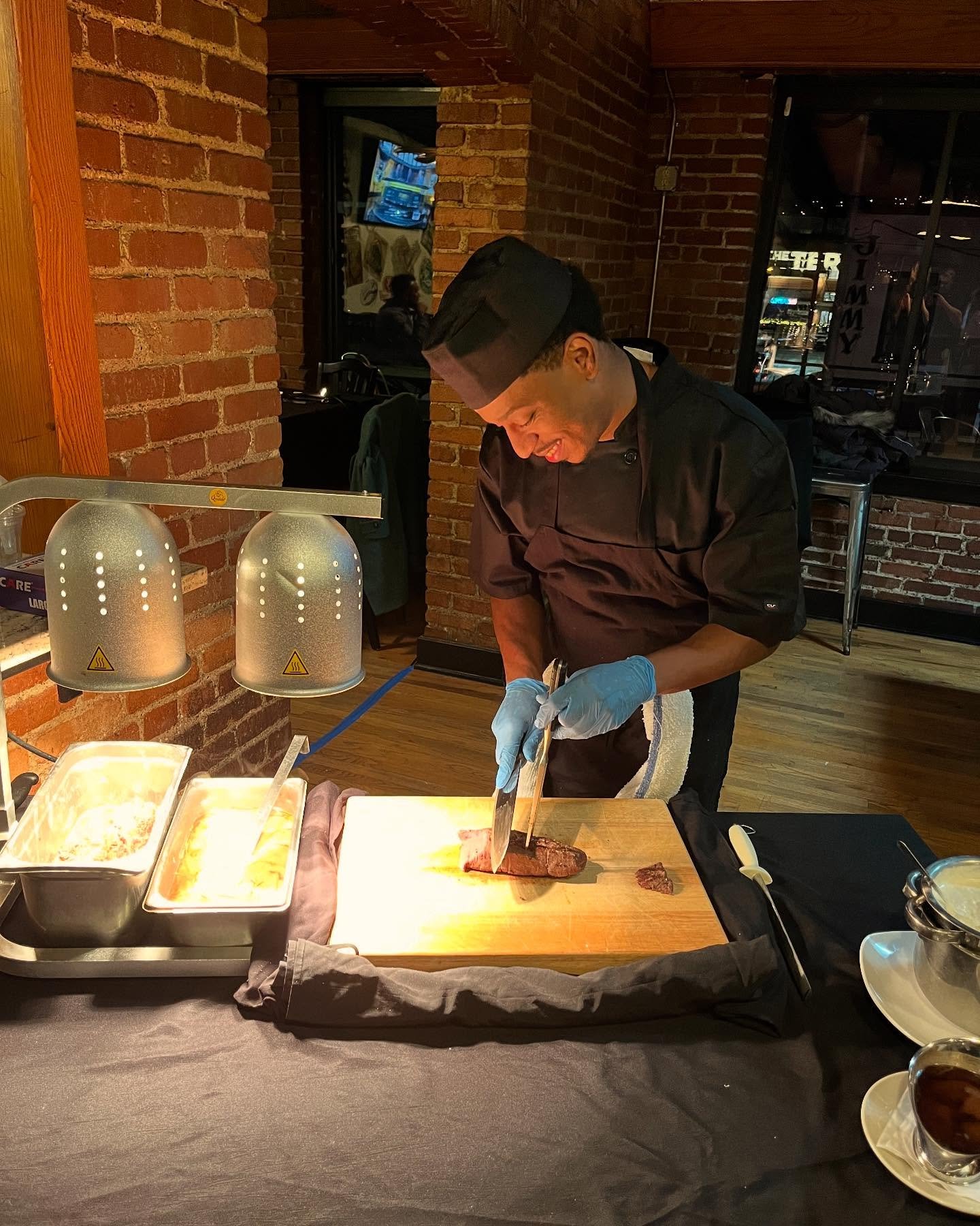 One of our lovely Chefs at the carving station for our wonderful filet! 🥩 Just another reason we here at Roland&rsquo;s do it better! 😎🤯 books an event with us online! 
#food#restaurant#cocktails#foody#cool#ohyeah#stripdistrictpittsburgh#wow#steak