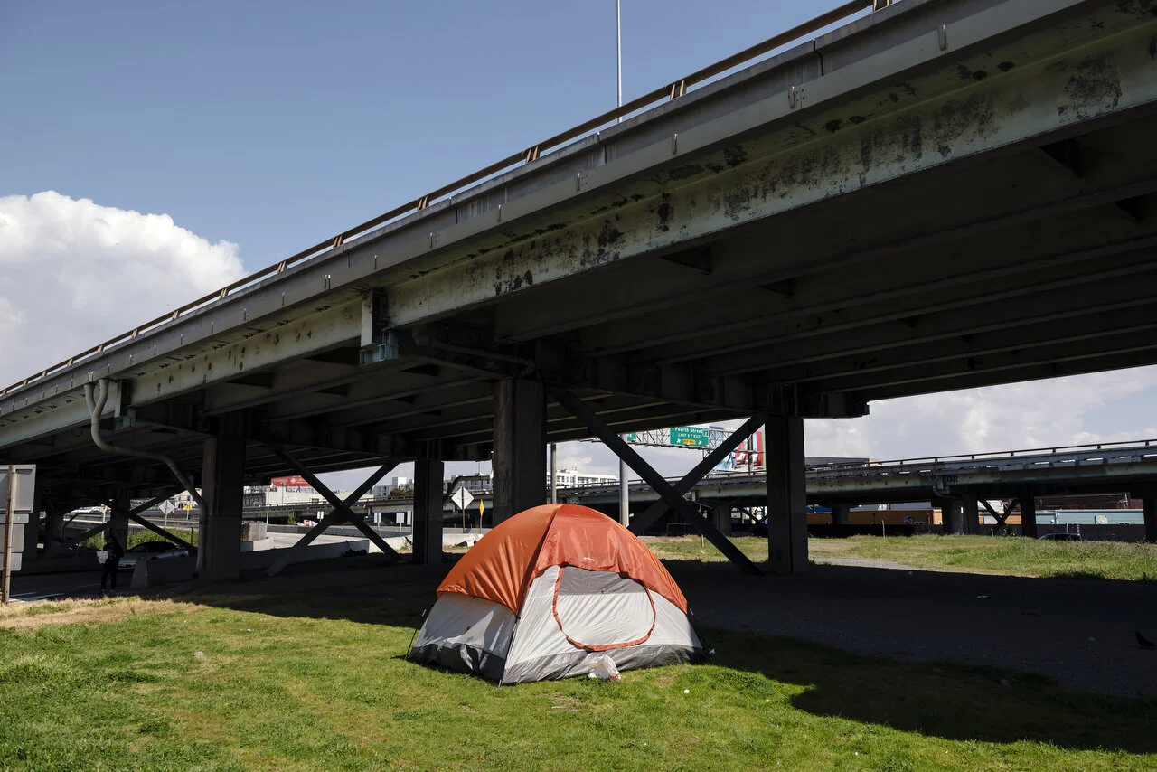  A homeless persons tent under an overpass in San Francisco, following a shelter-in-place order made by the mayor, March, 2020,  For Bloomberg. 