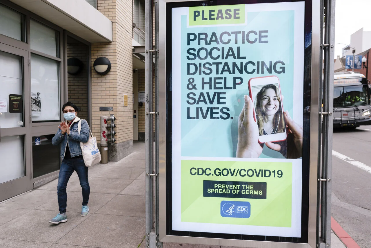  CDC sponsored bus stop signs in San Francisco following a shelter-in-place order made by the mayor, March, 2020,  For Bloomberg. 