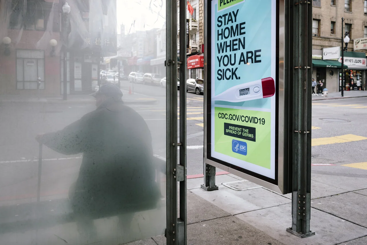  CDC sponsored bus stop signs in San Francisco following a shelter-in-place order made by the mayor, March, 2020,  For Bloomberg. 