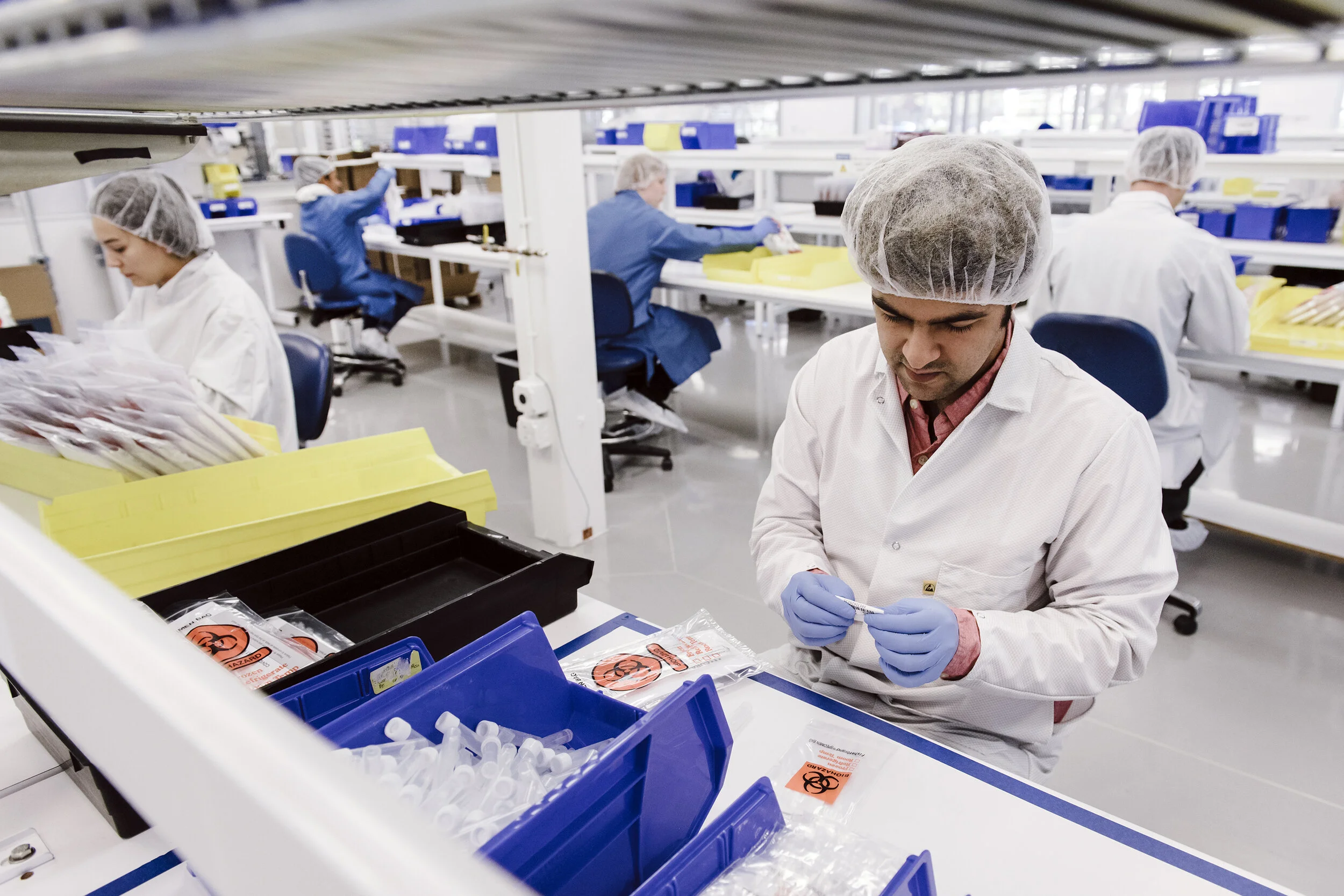  Assembly workers assemble Covid-19 testing kits at Evolve Manufacturing Technologies Inc., which has switched from making other medical equipment to making supplies for clients fighting the novel coronavirus, in Fremont, Calif, on Wednesday, April ,