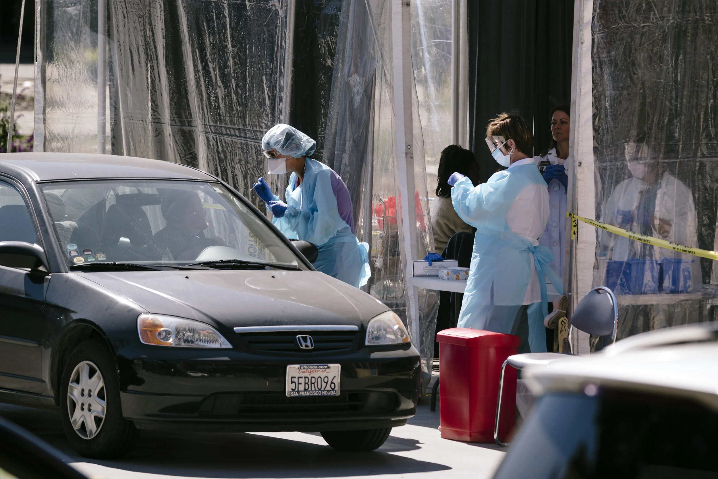  Kaiser clinicians test a patient at a drive-thru COVID-19 testing station on  Kaiser Permanente's French Campus in San Francisco, California, US, on Wednesday, March 12, 2020.  For the Washington Post 