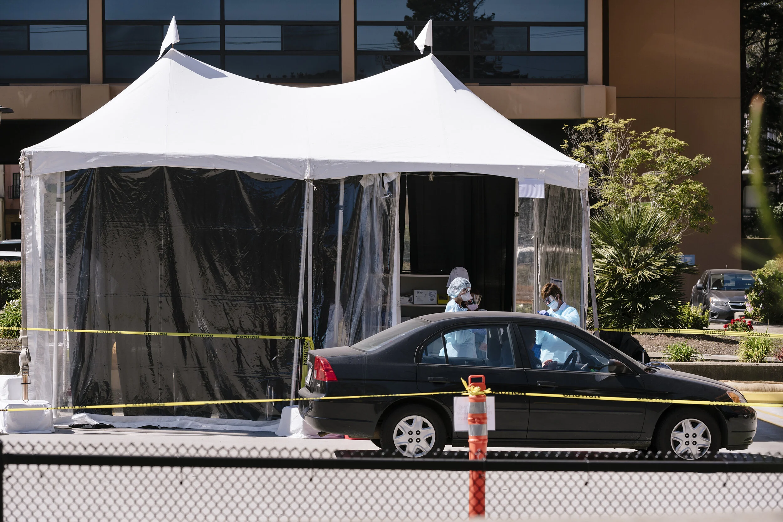  Kaiser clinicians test a patient at a drive-thru COVID-19 testing station on  Kaiser Permanente's French Campus in San Francisco, California, US, on Wednesday, March 12, 2020.  For the Washington Post 