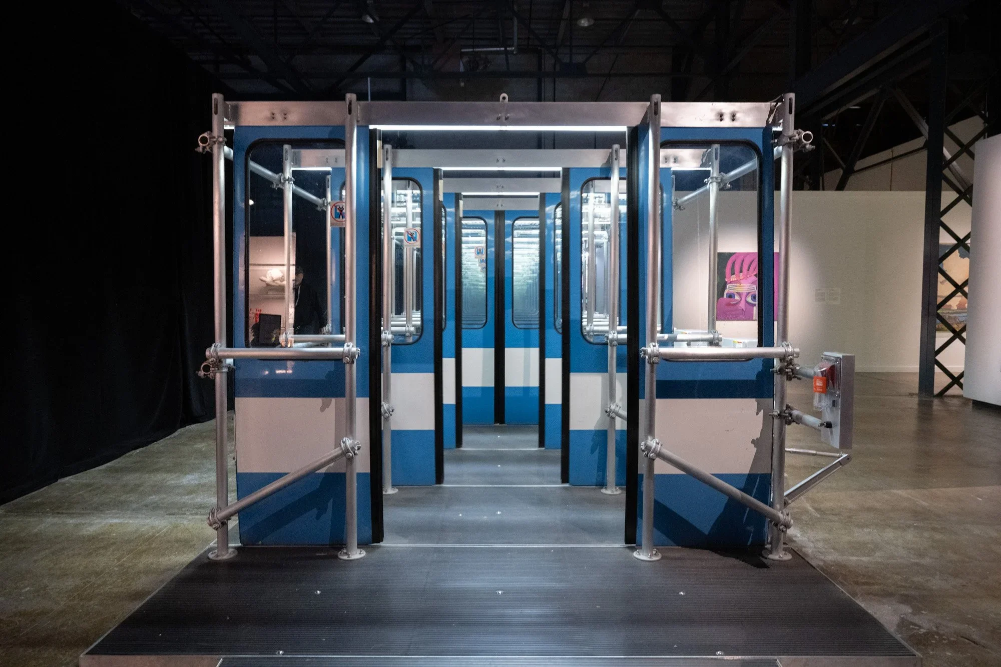   Michel de Broin ,  Seuils / Thresholds , 2017 Portes de métro récupérées, détecteurs de mouvement / Recovered subway doors, motion detectors.  15 x 3 x 2.3 m. / 590,55 × 118,11 × 90,55 in © Studio Lux 