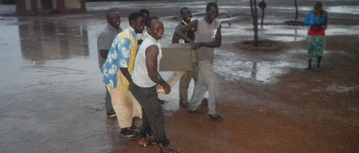 The community produced 8 BioSand Filters that are still being used daily. Here they're transporting a filter to its home. 