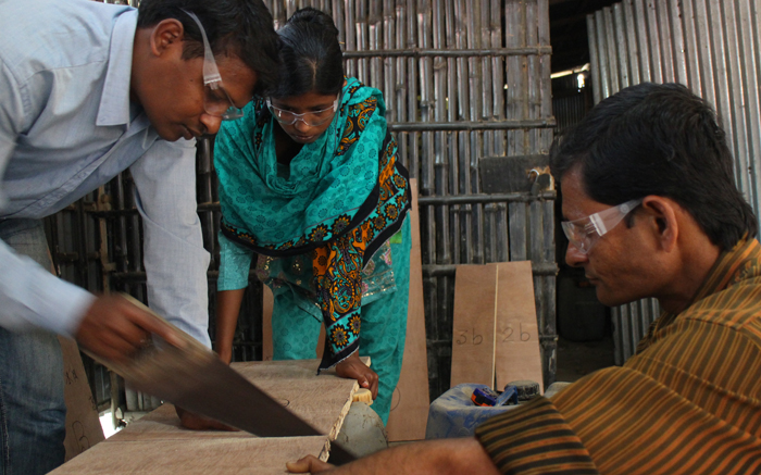 Asit, Sabina, & Hasan building the Wood Mold.