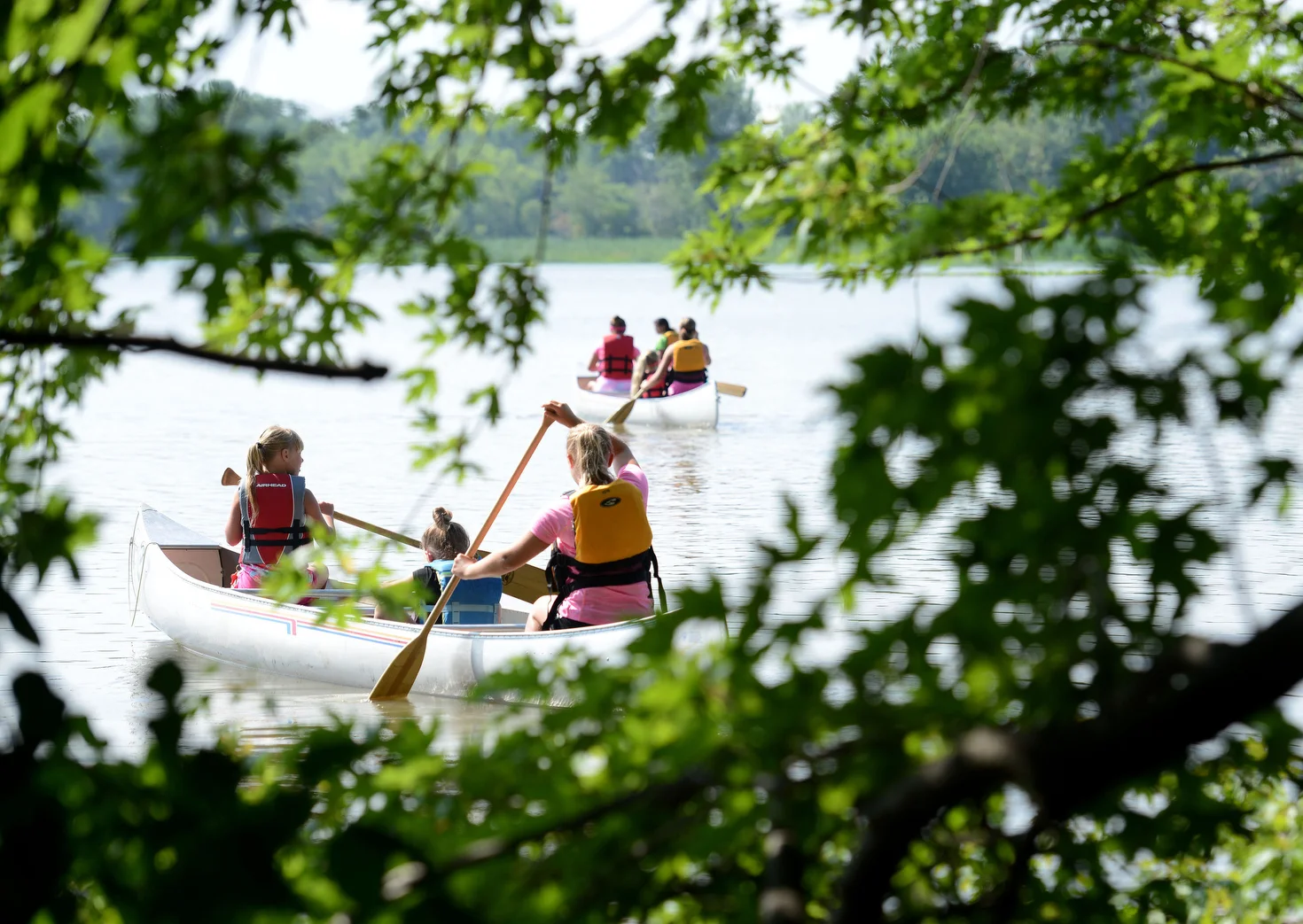  Summer camp participants paddle off into East Sandusky Bay during a program put on by the Sandusky Recreation Department and Erie MetroParks on Friday, July 14, 2017 at Big Island Preserve's canoe launch area in Sandusky, Ohio.  