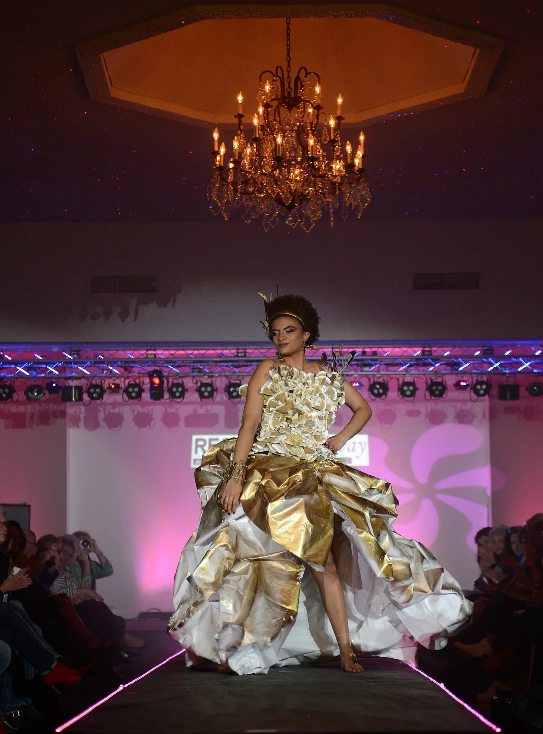  Model Nashia Gerold strikes a pose for the crowd during the Recycled Runway: A Clean Water Cause on Friday, April 13, 2018 in Sandusky, Ohio. Gerold was wearing a gown designed by Abigail Brunow and received second place overall. 