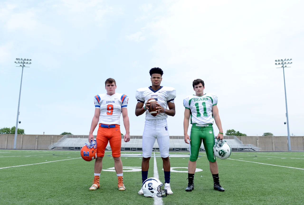  Local high school football standouts pose for a photo on Strobel Field in Sandusky. 