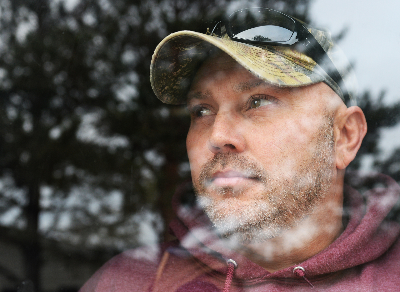  Patrick Baker Jr. looks out the door of his home in Clyde on Wednesday, Jan. 11, 2017. Baker says he is not the same person after spending 16 months in jail from a conviction that was later thrown out by an appellate court. 