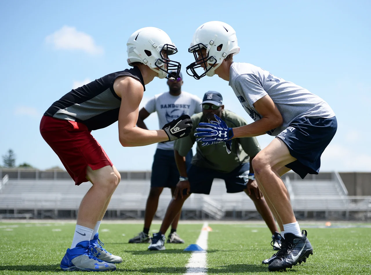  Two Sandusky High School football players participate in the team's first day of practice on Monday, August 1, 2016 at Strobel Field in Sandusky. 