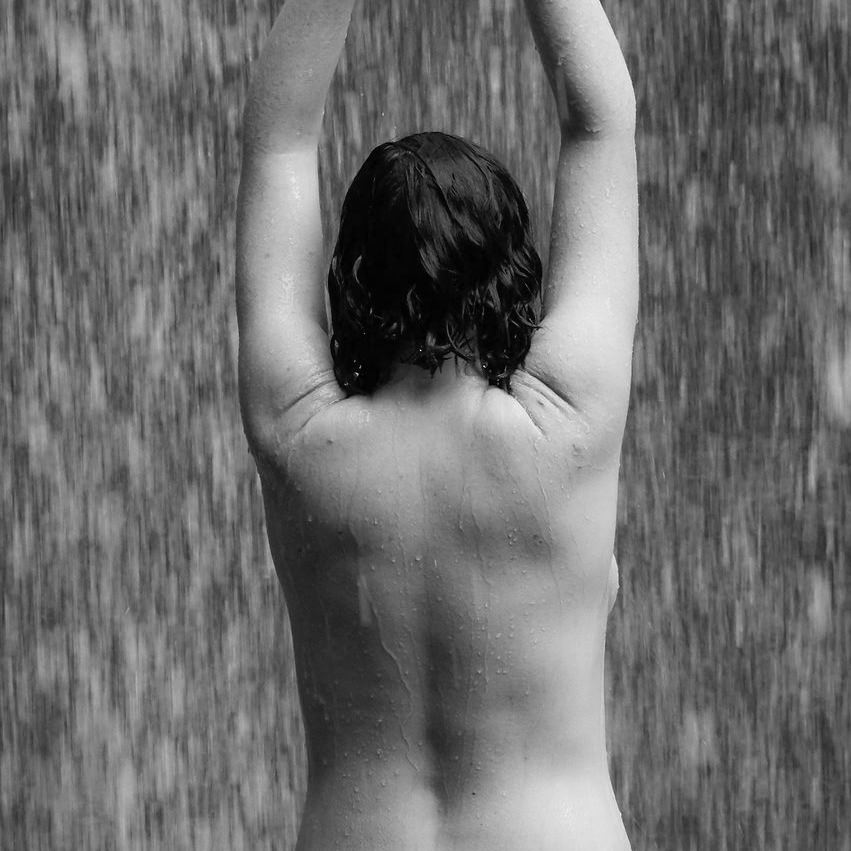 Naked woman back under rain Journeying shamanism
