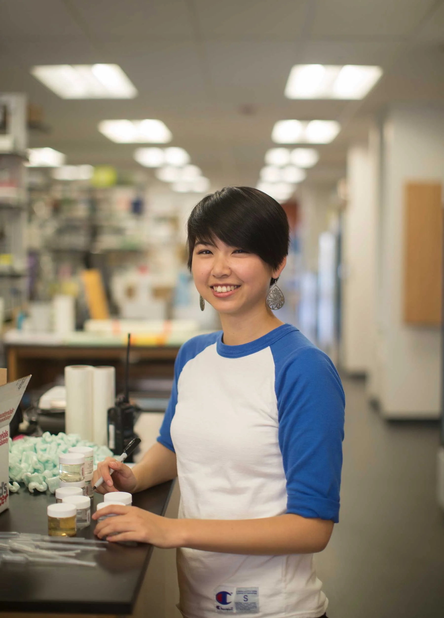 Science student working in college lab.