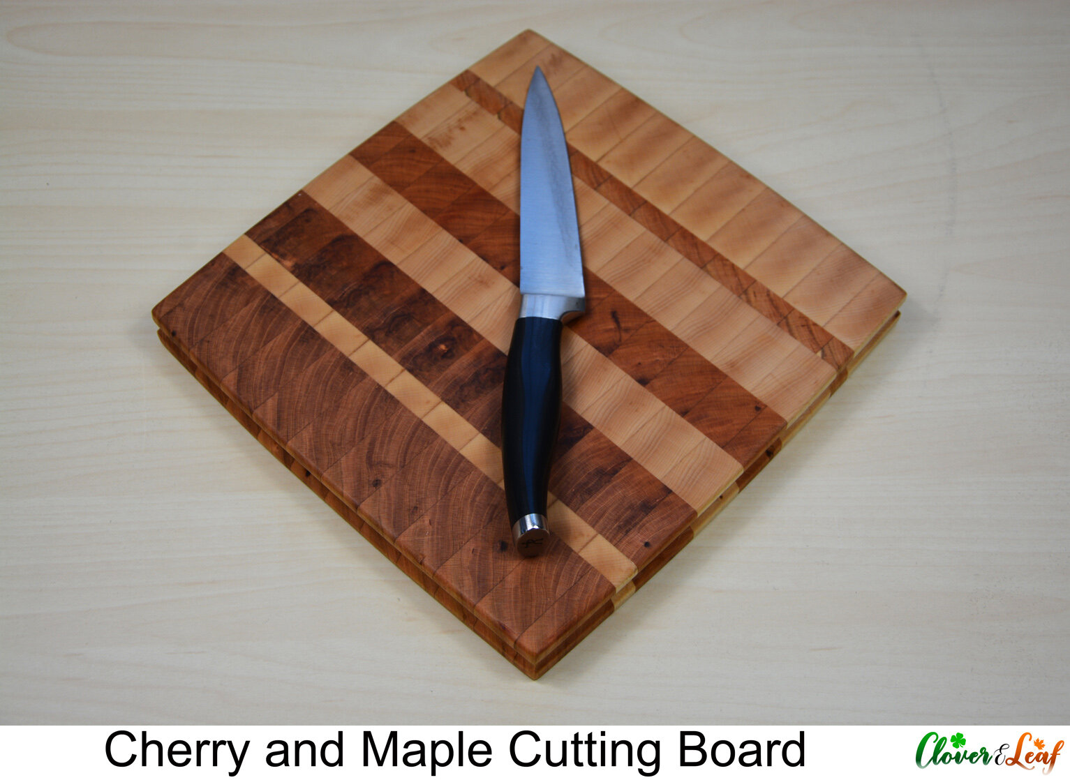 Cherry and Walnut Cutting Board From Above with Knife.jpg