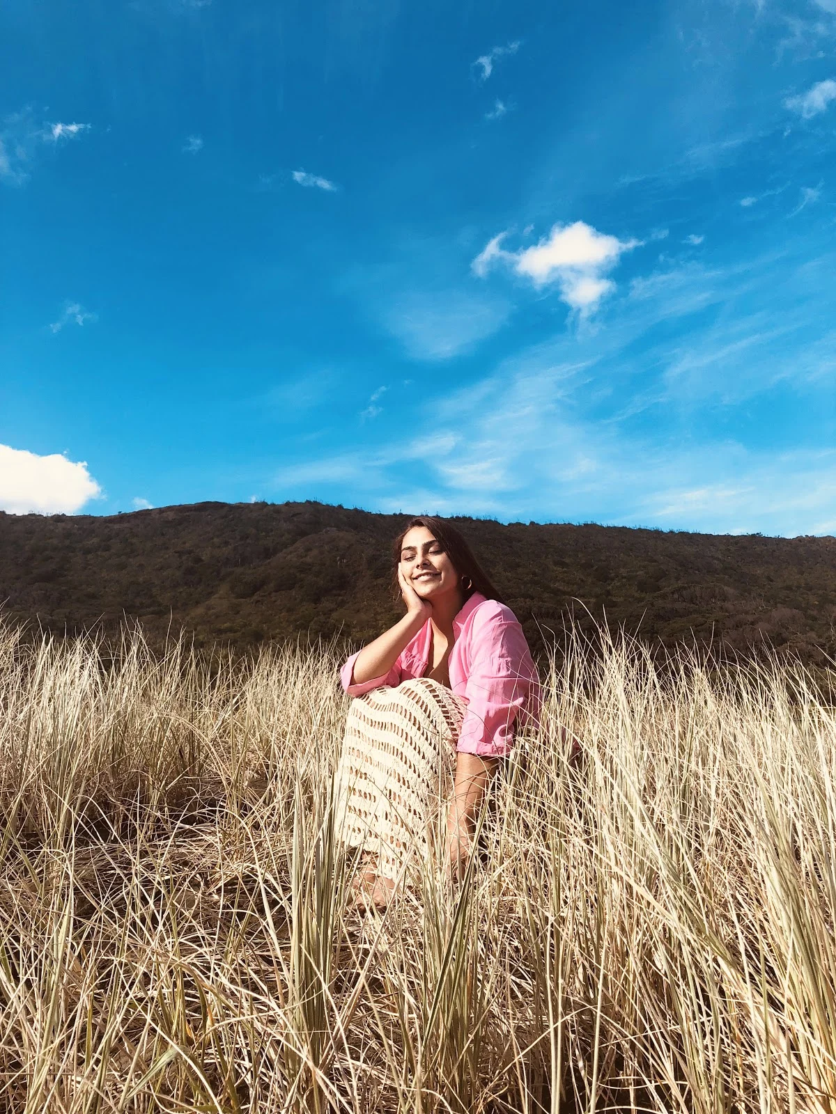 Kaity Gould in the field smiling