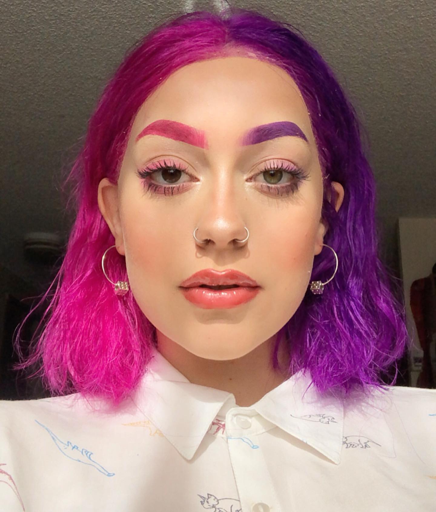 Eli Torkington - half pink and half purple make up and hair look