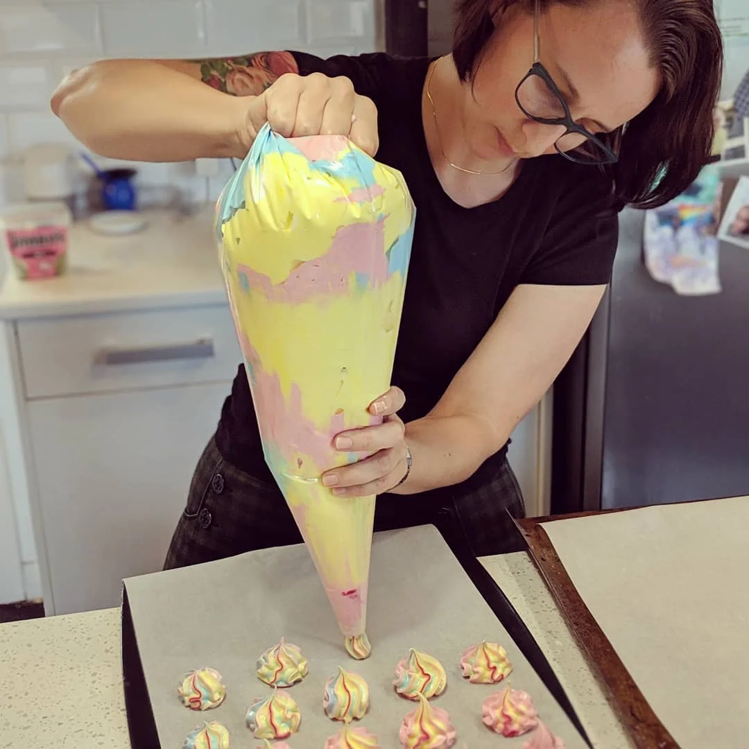 Tanya baking rainbow meringues