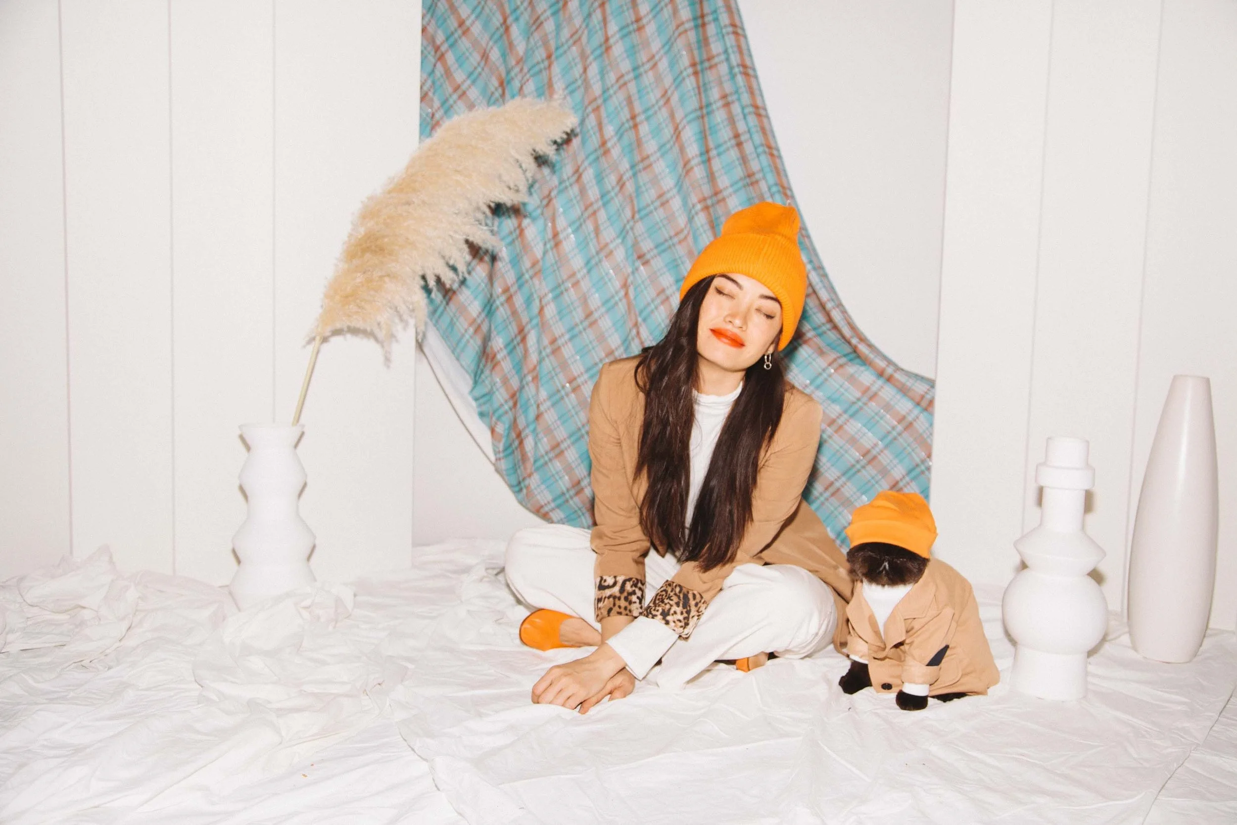 Puno and Maud’Dib, looking fly with orange beanies and chill with their eyes closed.