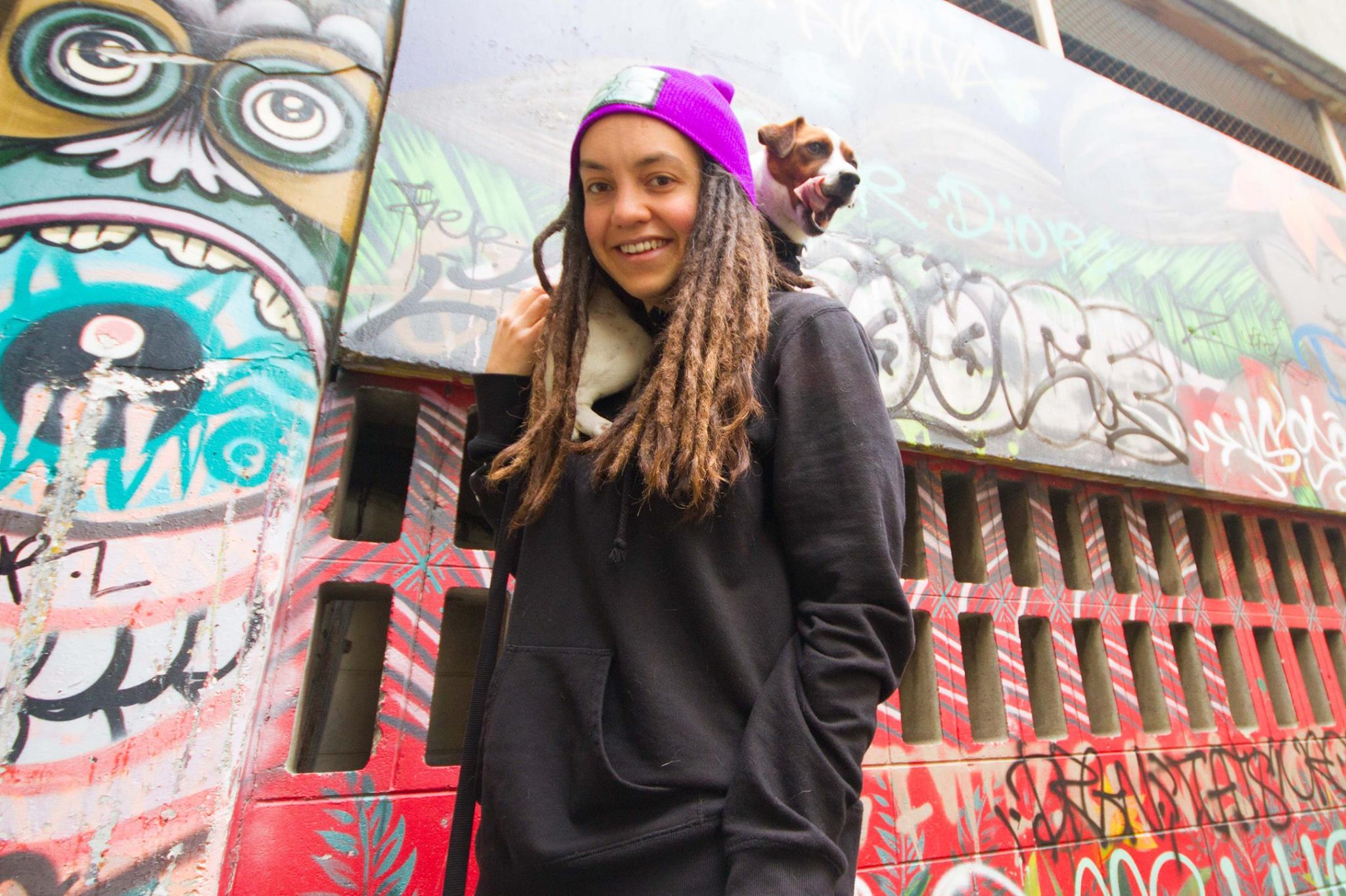 Laura O'Connell Rapira with a pup over her shoulder