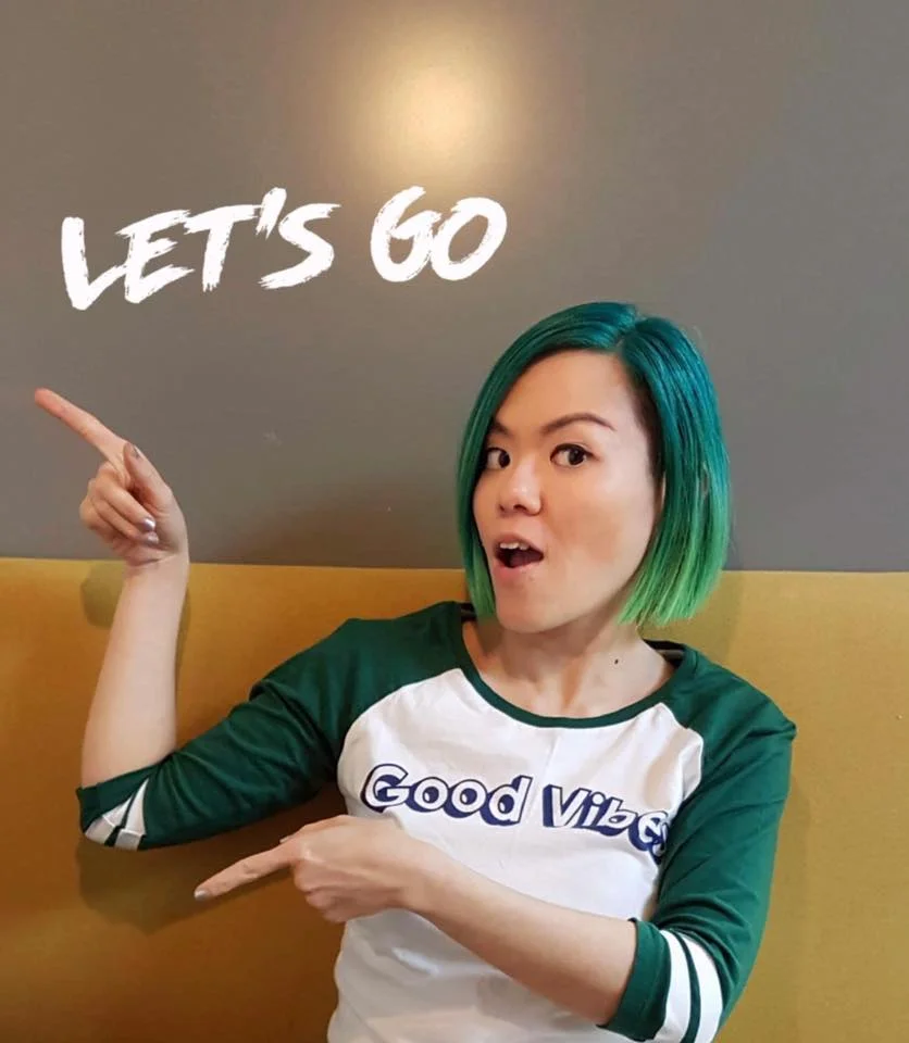 Penny Soo pointing to the wall that says “Let’s go”