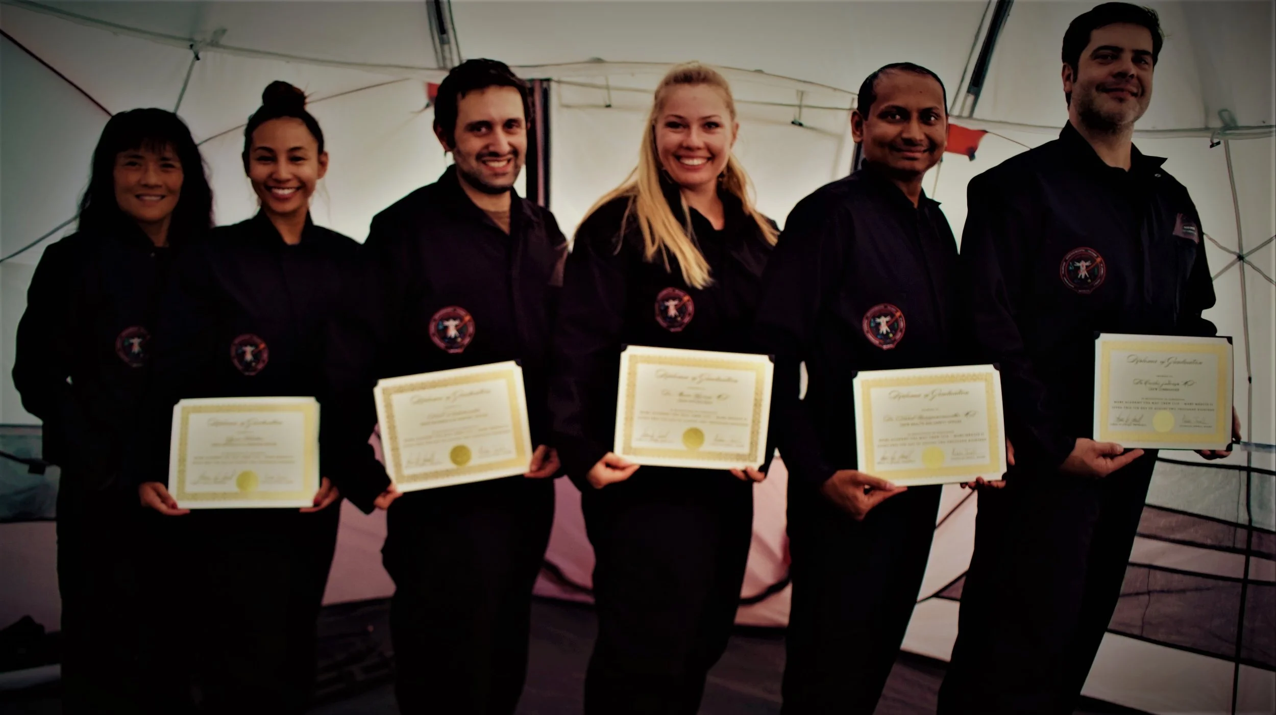 MAU Crew 1115 - Mars Medics II: Graduation Day at end of a successful training mission. Crew receiving their Graduation Diplomas