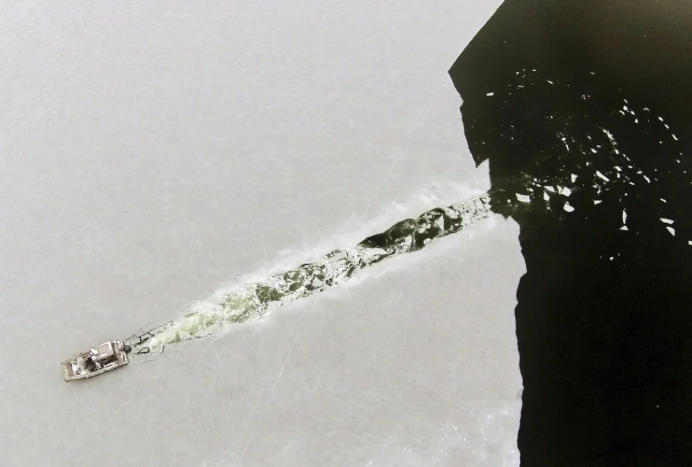 boat cuts through ice by Peter Periera.jpg
