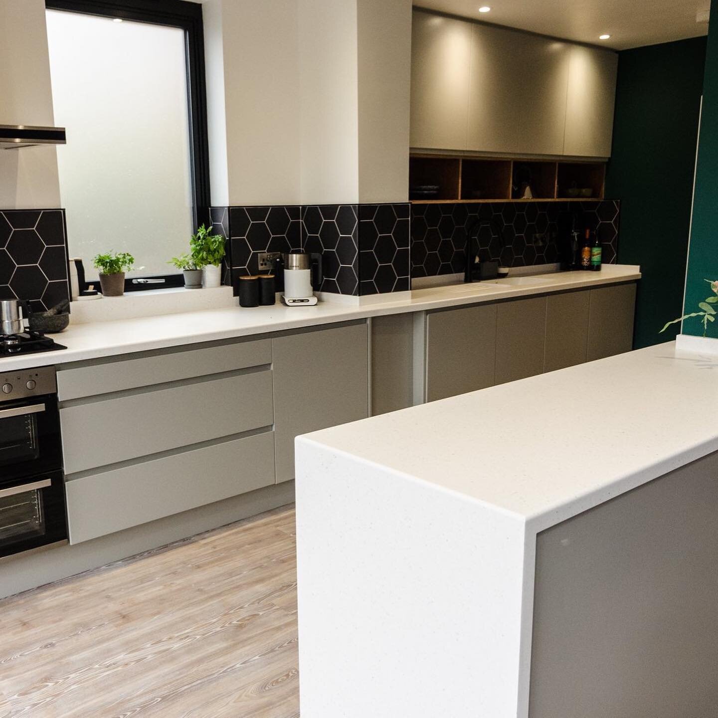 What a beautiful kitchen! 
Our joinery team manufactured and installed this Corian solid surface recently for a client based in Sheffield. 
The project involved working around the unusual shape of the walls to provide a seamless finish to the worktop
