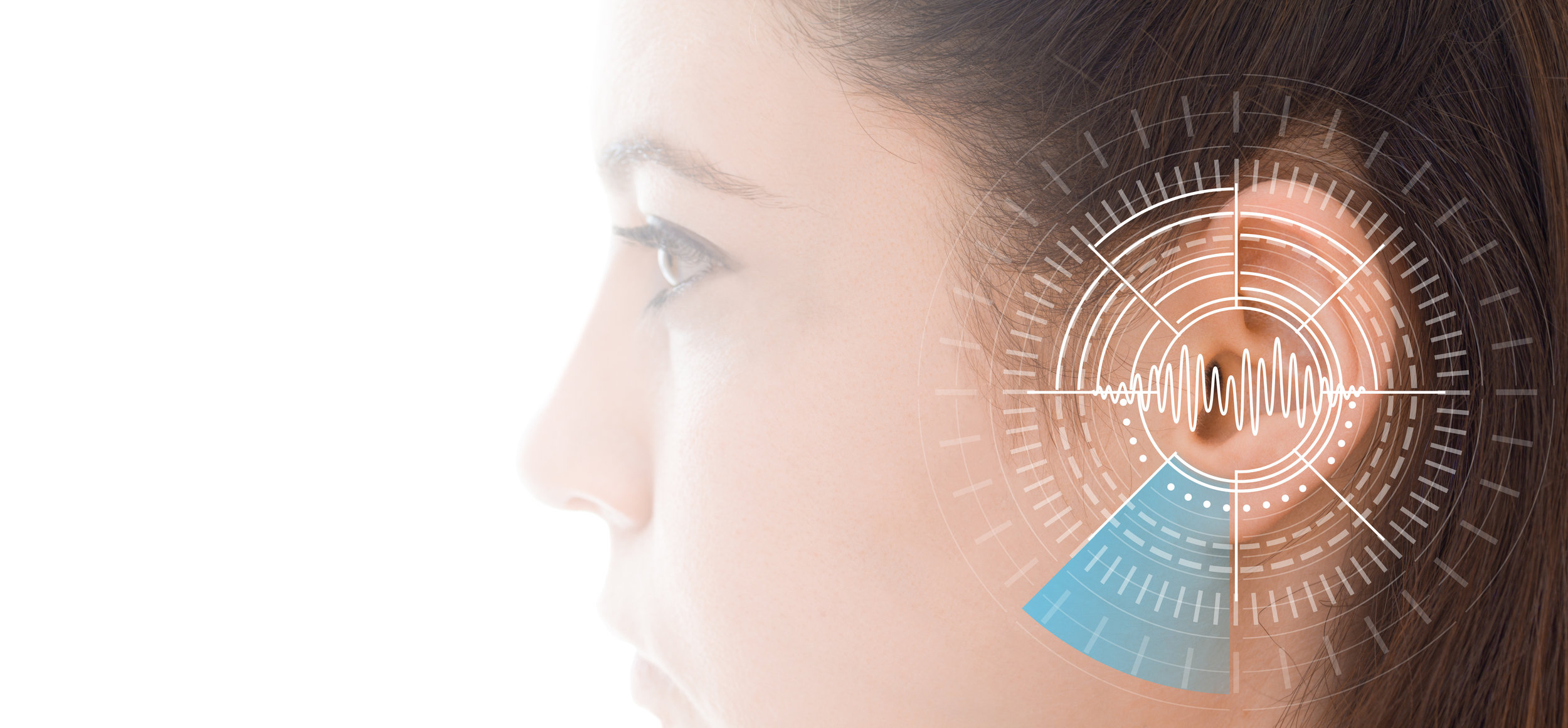 Hearing test showing ear of young woman with sound waves simulation technology