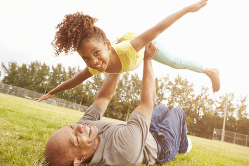 Copy of Copy of Grandfather Playing Game With Granddaughter In Park