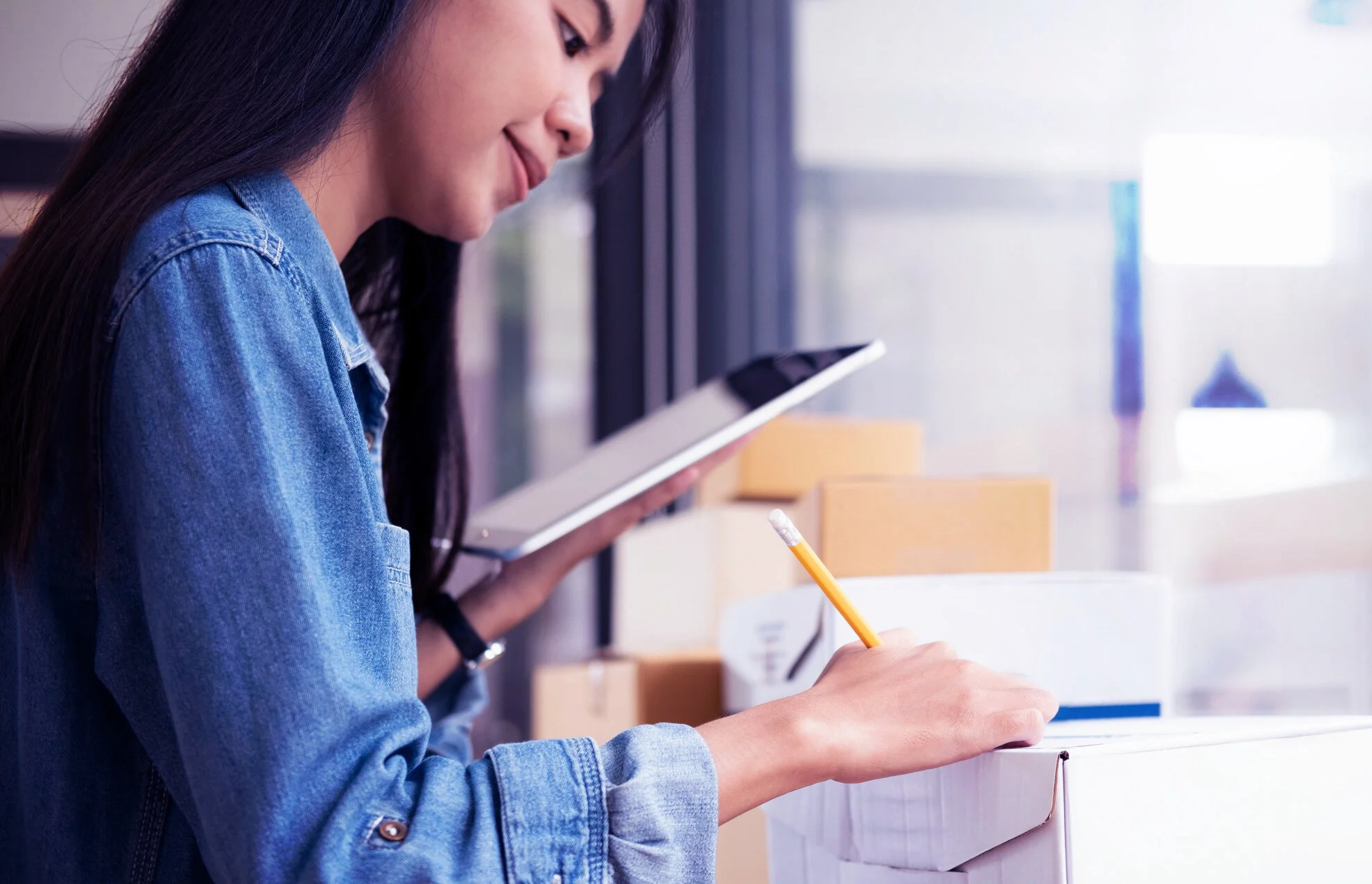 sweet-young-female-business-woman-holding-noteboard-checking-stock-goods_t20_GJBPL0.jpg