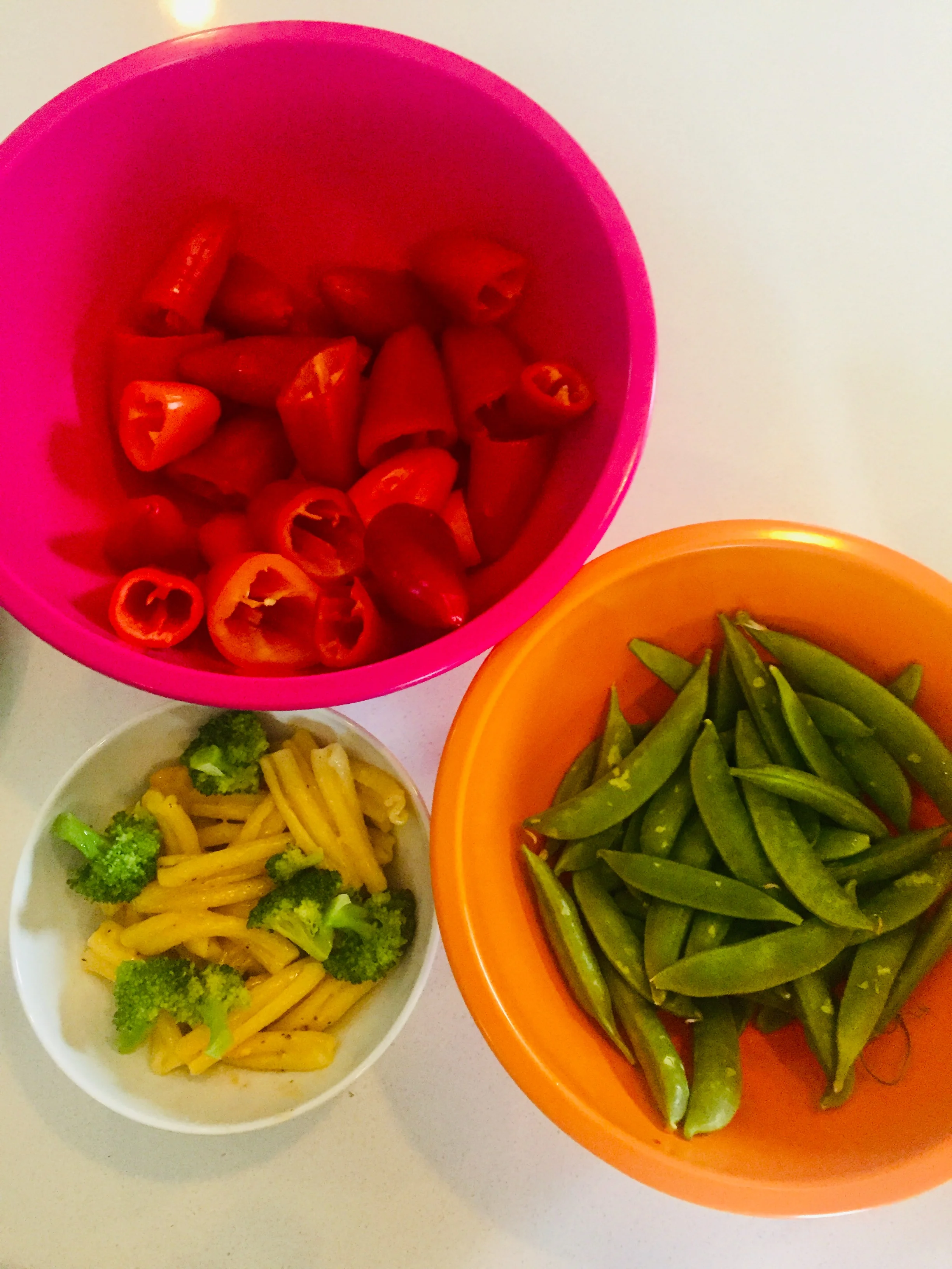 Peppers, snap peas, whole wheat pasta and cooked broccoli (with butter and salt).