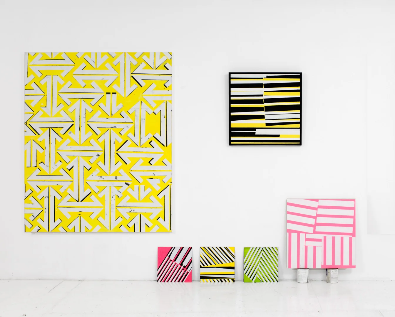 An installation shot showing works from the two series Reign Marks and Company Paintings
