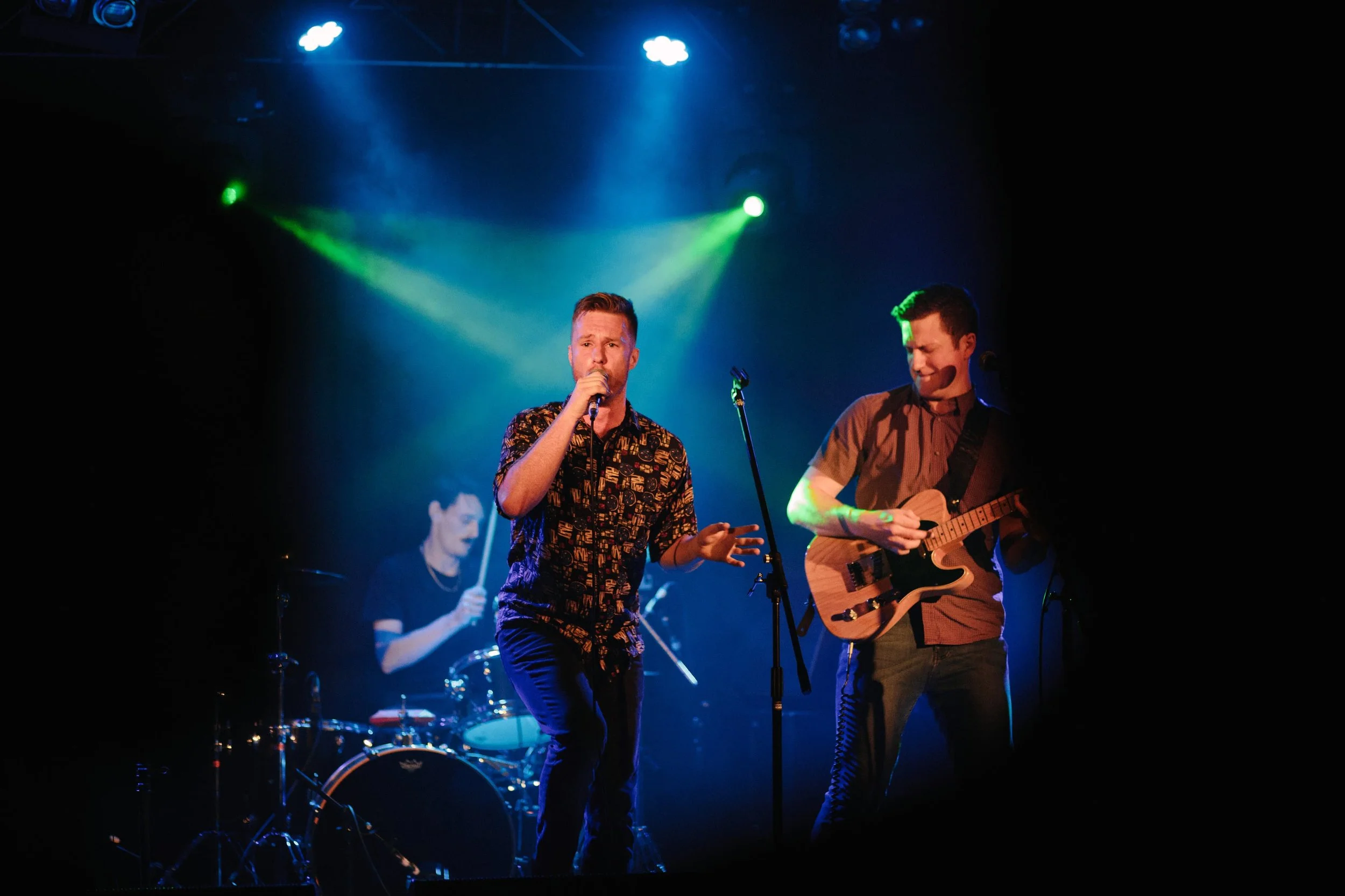 Andrew pulling shapes as frontman for local band Choking Stanley.
