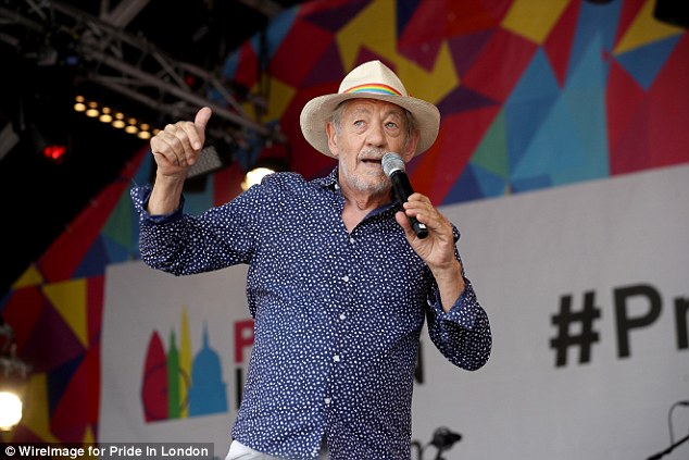 Happy: The Lord Of The Rings star couldn't be missed with his rainbow adorned cream trilby, and proudly flew the LGBT flag before hoping on stage to address the excited audience