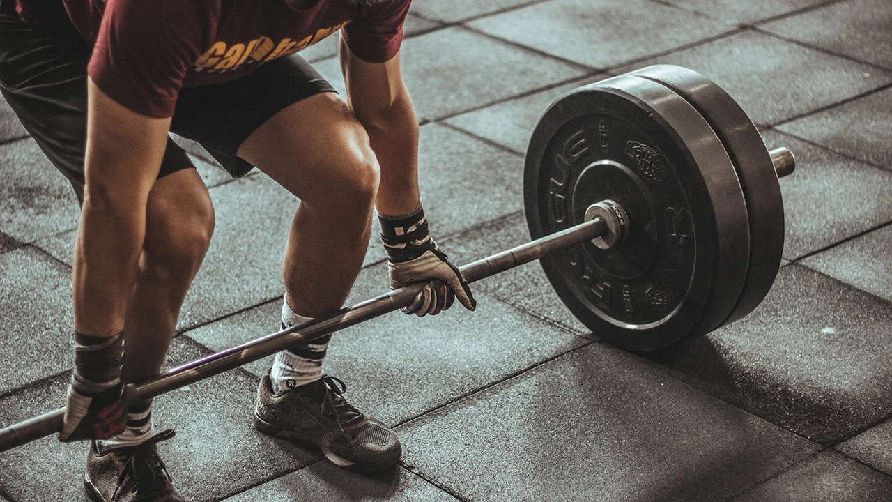 S&C man with weight 1280 optimised.jpg