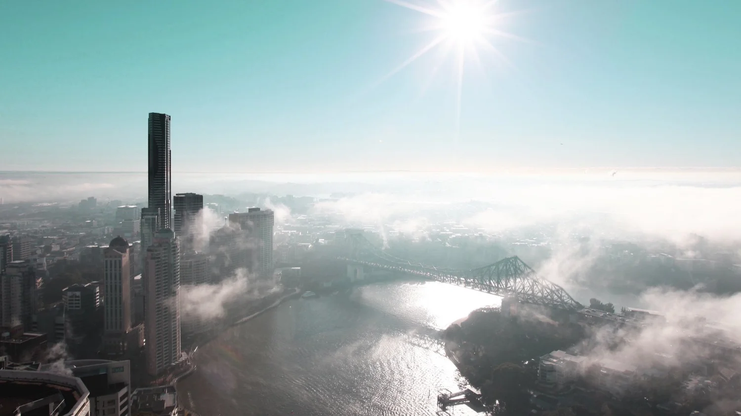 Brisbane River, Story Bridge and city towers on a misty morning