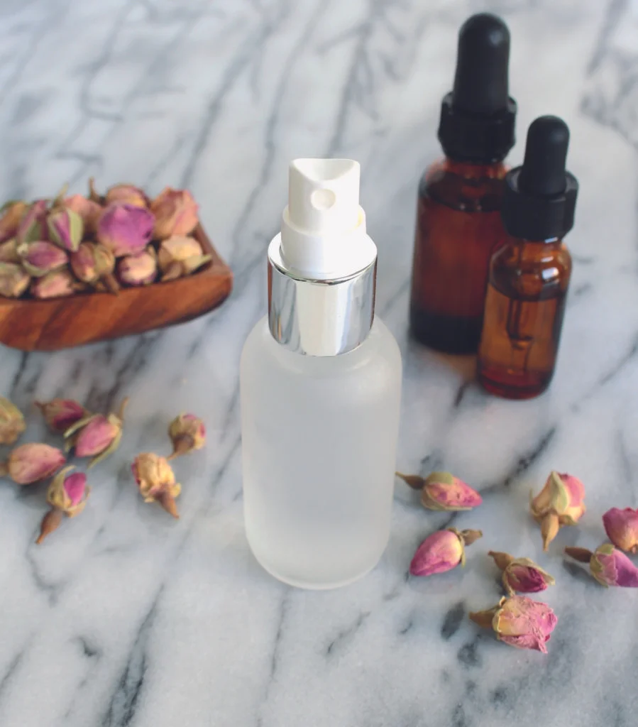 dried roses with spray bottle and serums