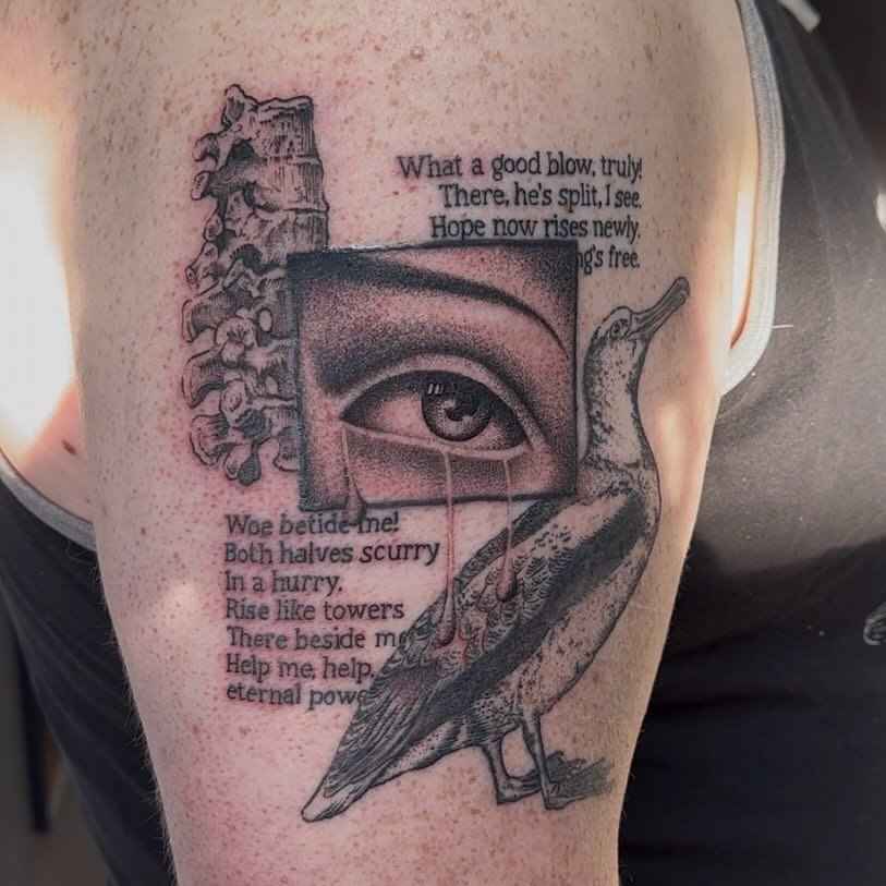 Tattoo on skin featuring a scoliosis spine, a realistic human eye, a bird with a long neck, and printed text.
